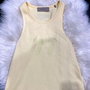 Small Essentials Fear of God shirt. Canary yellow. In great condition.
